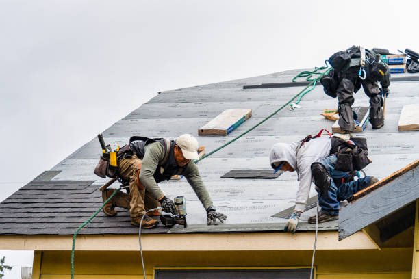Professional Storm Damage Roof Repair technician working in West Sand Lake, NY